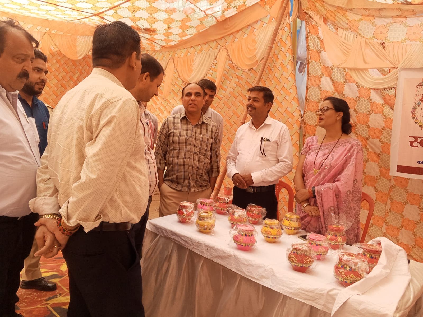 Women artisans decorating handcrafted clay products together