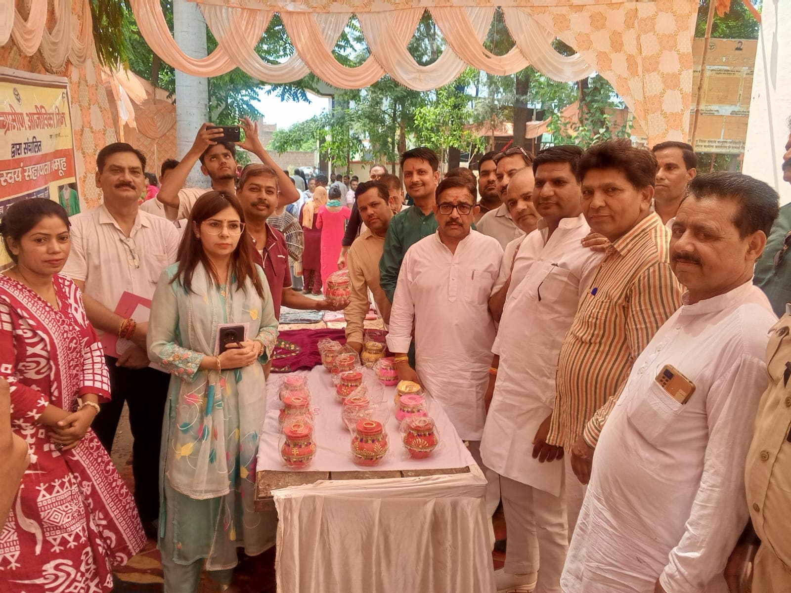 Officials visiting the Radhe Radhe exhibition stall